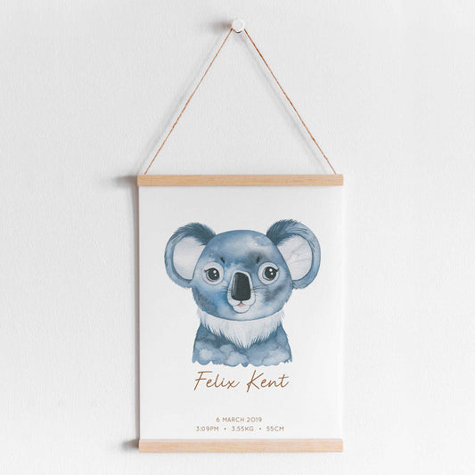A hanging frame of a watercolour koala kids personalised birth print