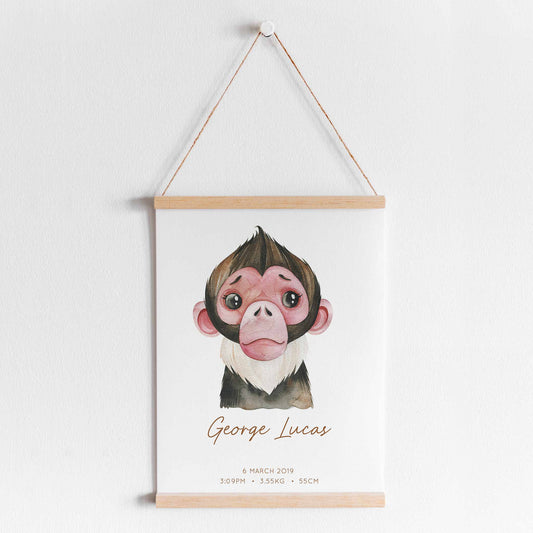 A hanging frame of a watercolour monkey kids personalised birth print