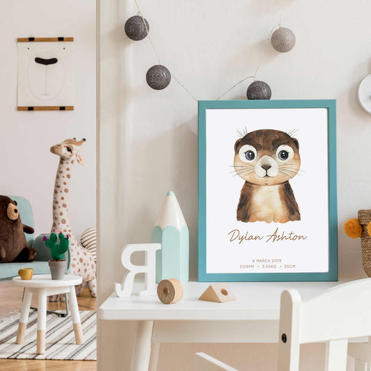 Framed picture of a watercolour otter kids personalised birth print in a child's nursery