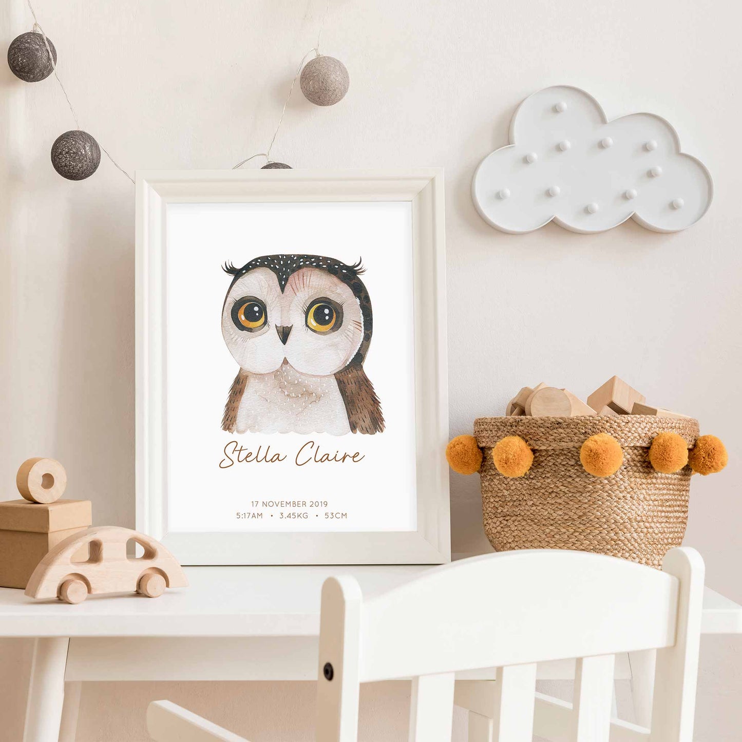 Framed picture of a watercolour owl kids personalised birth print in a child's nursery