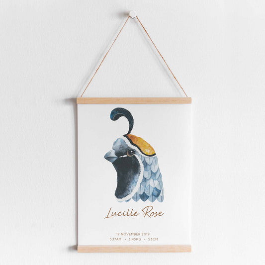 A hanging frame of a watercolour bird kids personalised birth print