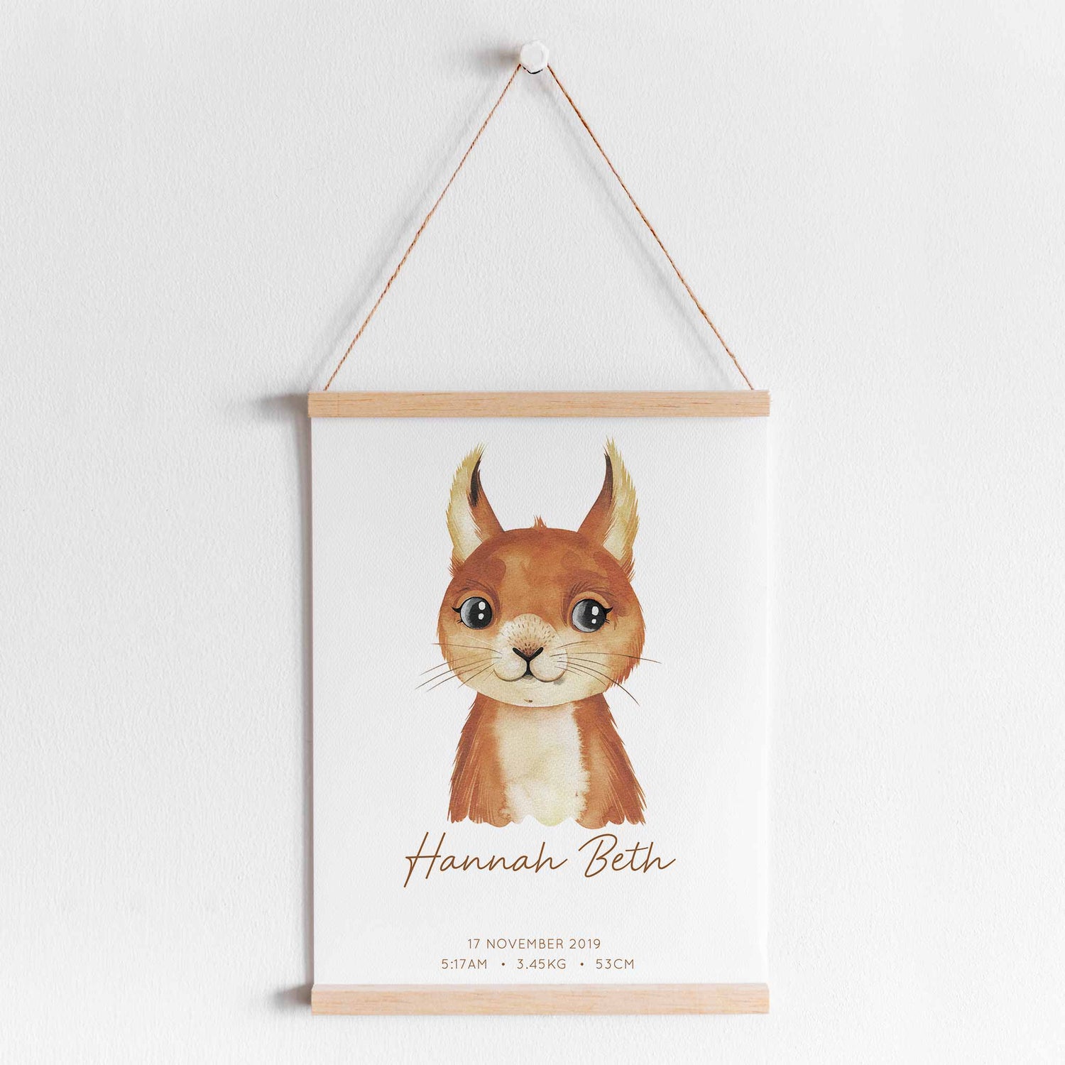 A hanging frame of a watercolour squirrel kids personalised birth print