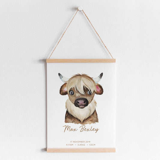 A hanging frame of a watercolour yak kids personalised birth print
