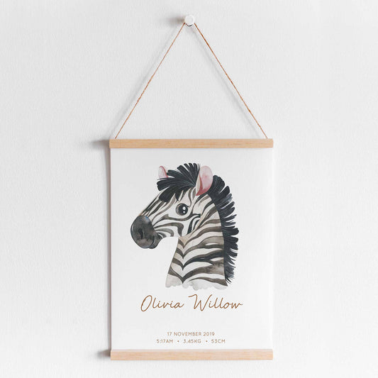 A hanging frame of a watercolour zebra kids personalised birth print