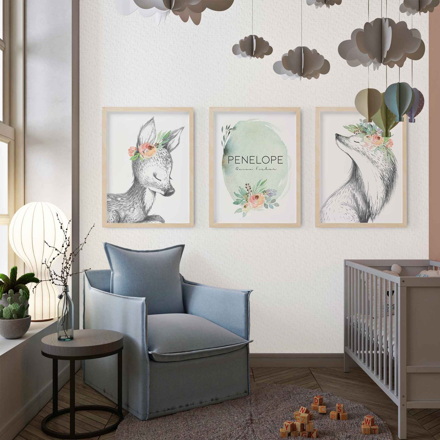 A set of 3 framed images of woodland deer and fox sketch floral nursery personalised birth print decorated in a nursery  Edit alt text