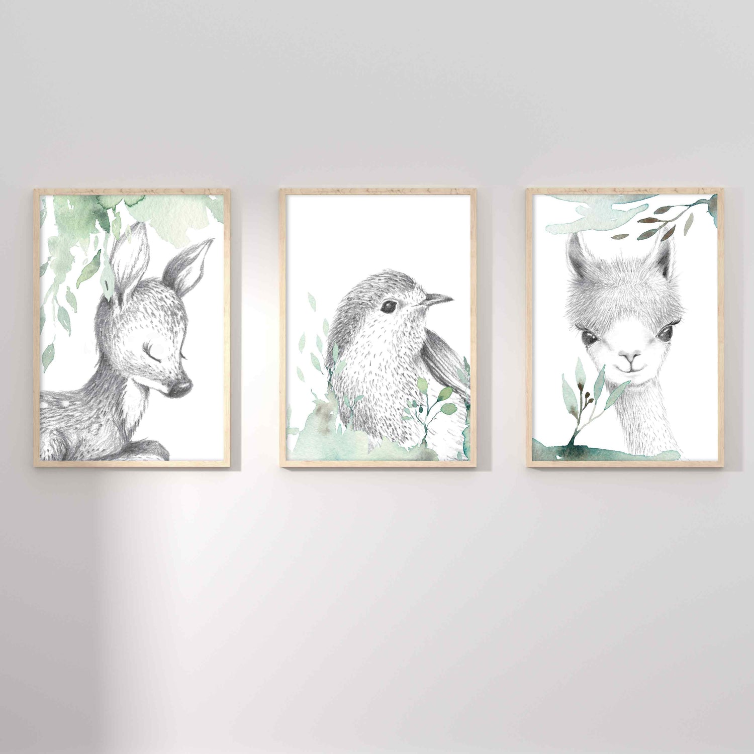 A set of 3 framed images of woodland deer, bird and llama sketch foliage nursery kids print