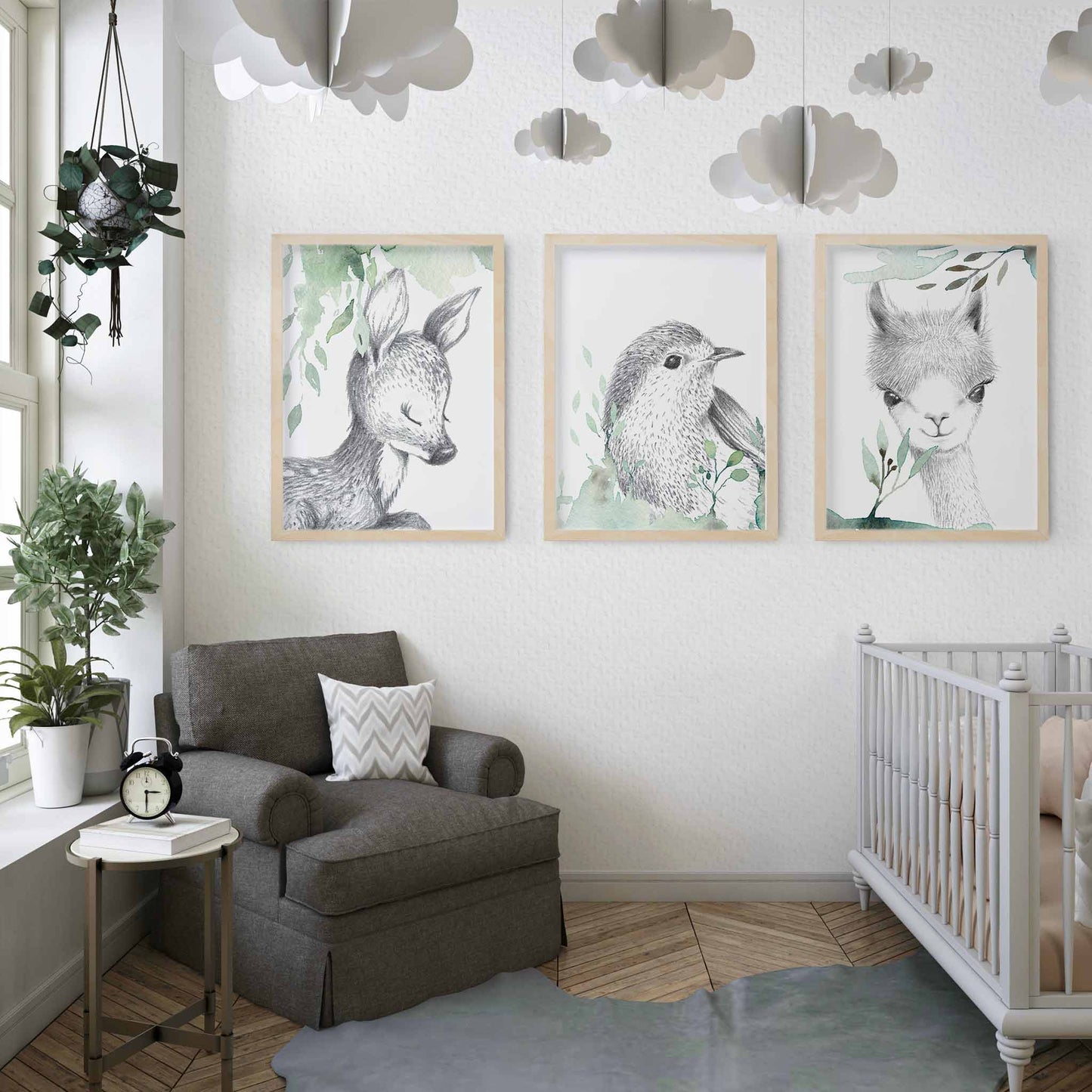 A set of 3 framed images of woodland deer, bird and llama sketch foliage nursery kids print decorated in a nursery