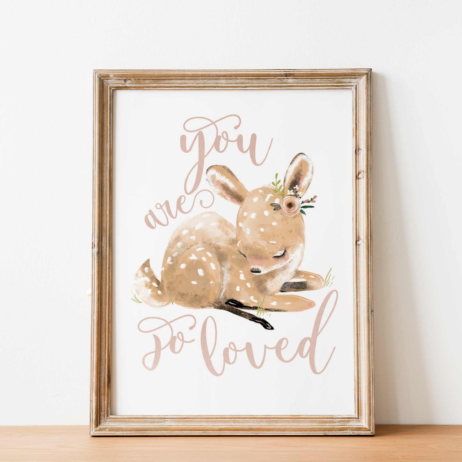 An oak frame of a cute whimsical deer with inspirational quote